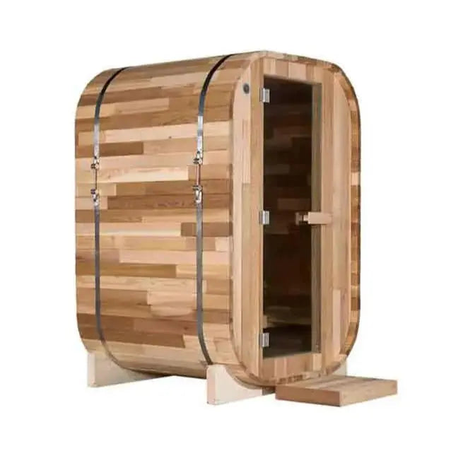 The Pod Sauna by Lunara is a compact rectangular outdoor sauna made from Canadian Cedar, featuring a glass door, metal bands, wood paneling, two wooden supports, and a small front step.