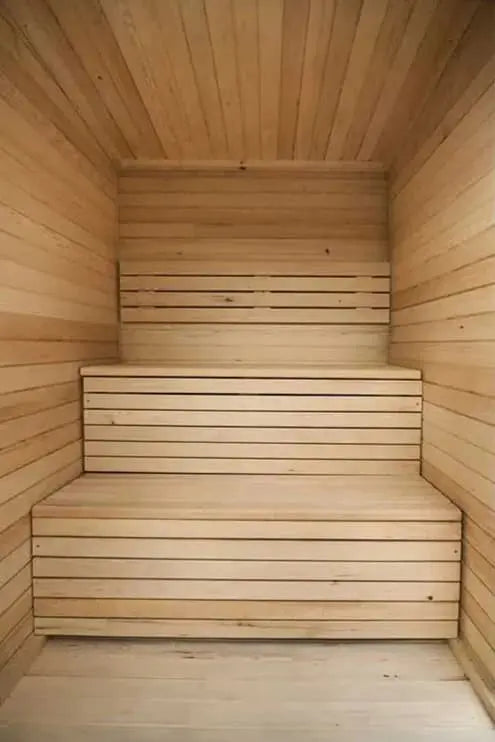 The Lunara Cabin Sauna - 4 person features three-tiered bench seating and smooth light wood planks on the walls, ceiling, and benches, offering a warm, clean atmosphere—ideal for powerful heating.